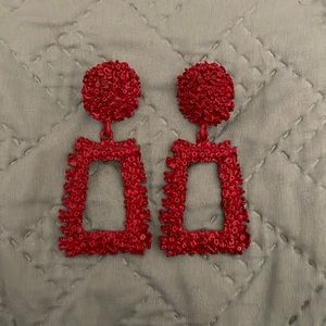 Red dangling earrings